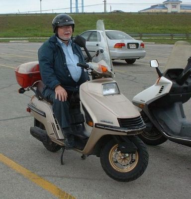 Dad on his Honda Elite 250cc scooter at the Live Oak Civic Center
Keywords: dad scooter honda live oak liveoak honda elite